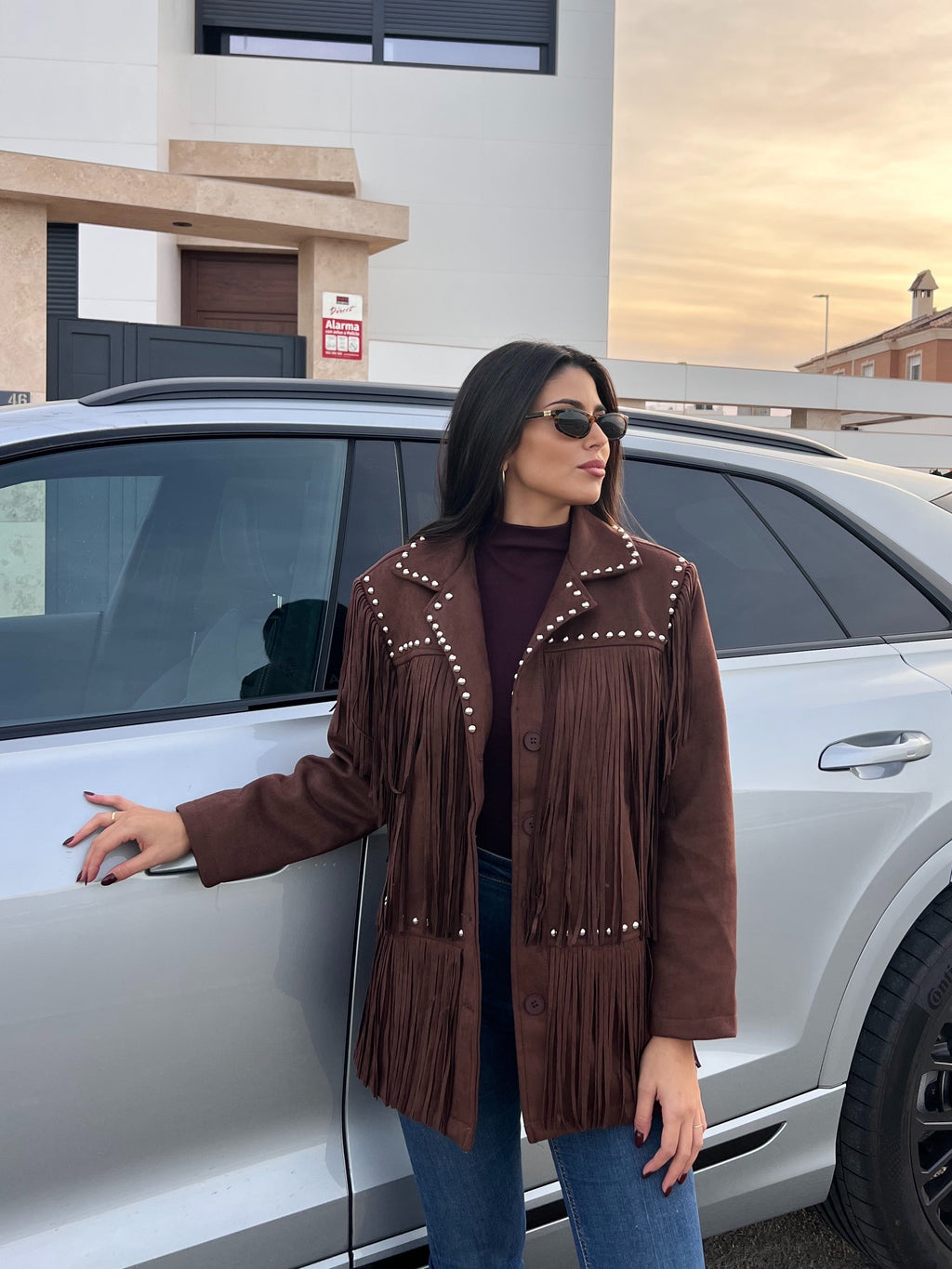 Chaqueta de flecos tachuelas